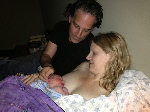 Mom, Dad, and newborn following home birth